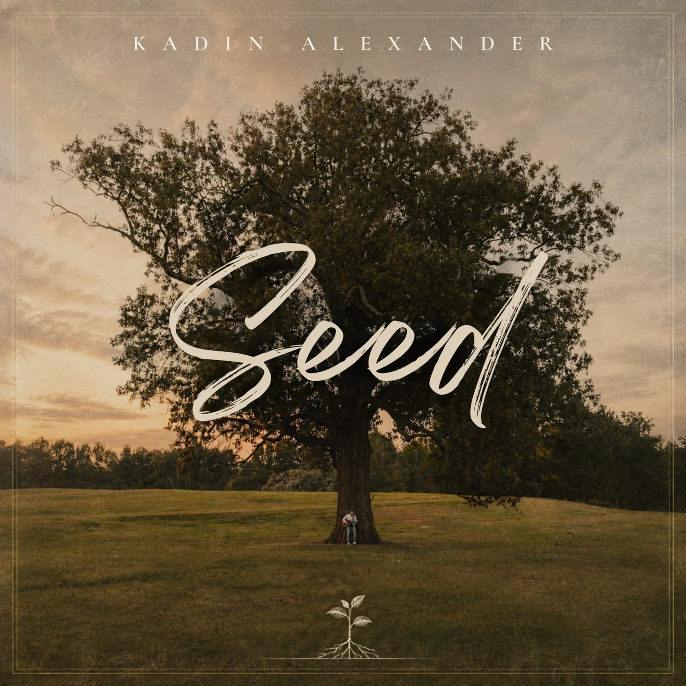 Official Seed single cover art showing a large tree at sunset